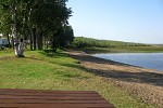 Photo of Kab Lake Lodge's 900 foot beach with sandy waters.